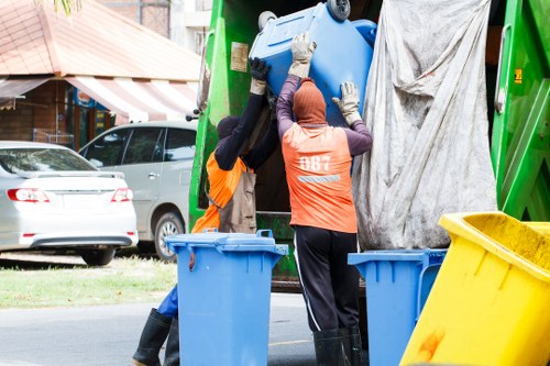 Two-person man and van crew loading a commercial unit